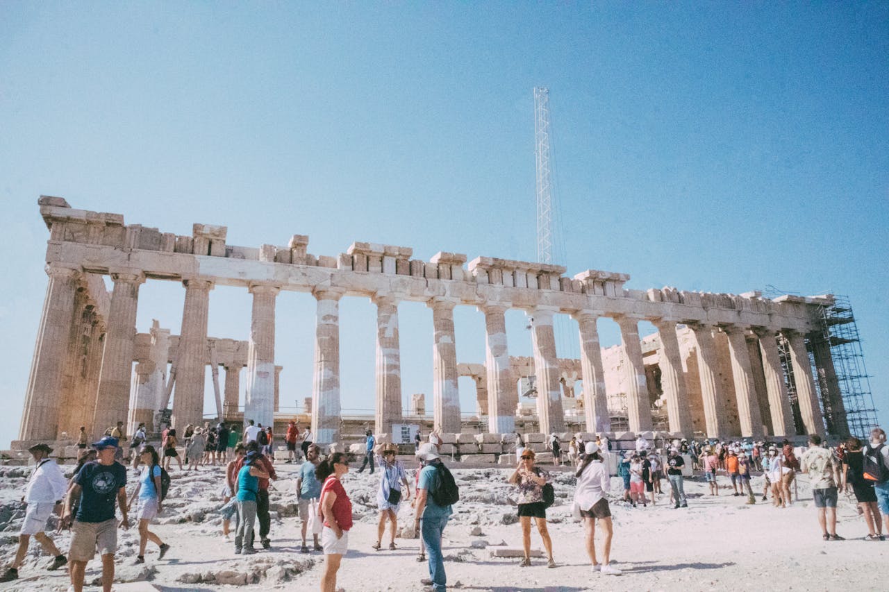 Visitors admire the historic Parthenon in Athens, a key UNESCO World Heritage site.